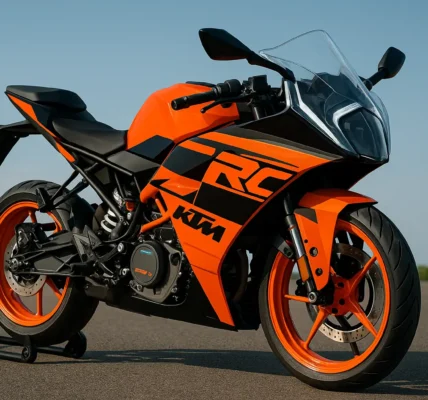 KTM RC 390 2025 sports bike parked on road under clear sky, showcasing aerodynamic design and orange-black color theme