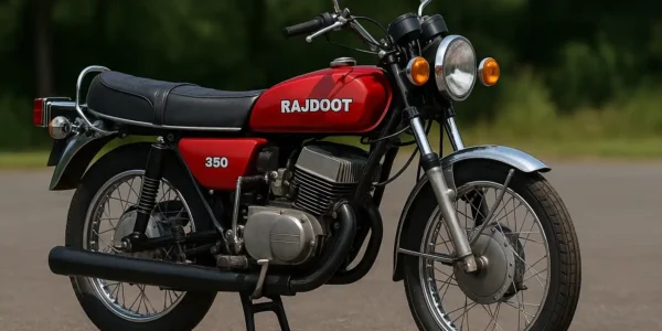 Rajdoot 350 vintage motorcycle in red color with chrome exhaust and twin-cylinder engine parked on a road in India