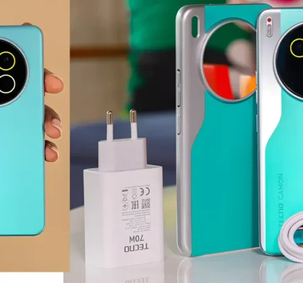 A high-quality lifestyle photo of the Tecno Camon 40 Pro placed on a table with travel essentials (headphones, coffee, laptop).